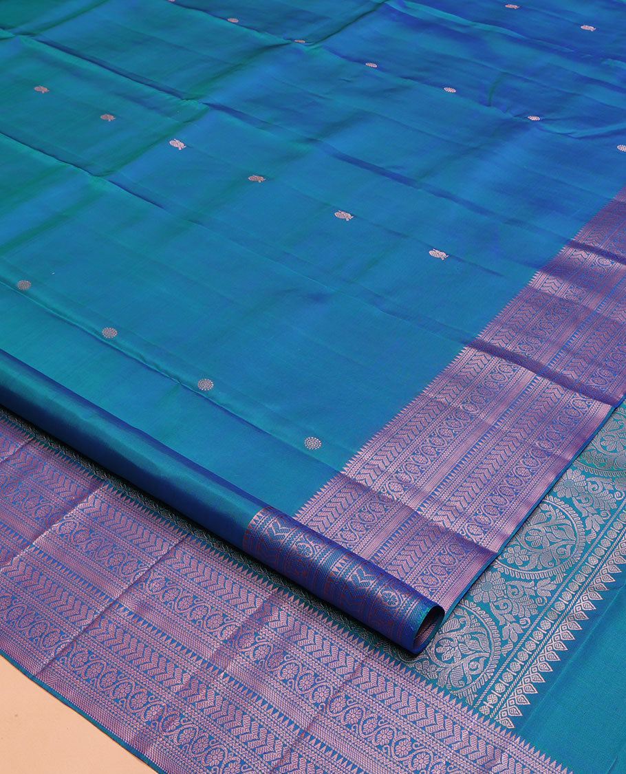 Blue Kanchipuram Silk Saree, Graced with Mayil and Chakram Thread Buttas on Its Body, Highlighted by a Self-Border of Rekku, Neli, Kathir, and Kodi Visiry Designs, Pallu of Jaal Designs, and Paired with a Matching Blouse