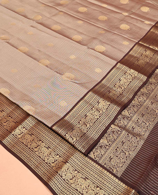 Brown Vasundhara Lite Silk Mix Saree, Enriched with Zari Buttas and Checks All Over Its Body, Complemented by a Contrast Border of Thilakam, Kodi Visiry, Kamalam, Mayil, and Yaanai Designs, Intricately Designed Pallu, and Paired with a Contrast Blouse