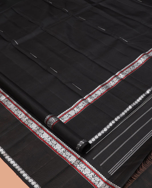 Black Kanchipuram Silk Saree, Delicately Woven with Buttas All Over Its Body, Highlighted by a Rettai Pettu Border of Thilakam Mokku, Neli, Mayil, and Manga Designs, Pallu Steeped with Stripes, and Paired with a Matching Blouse