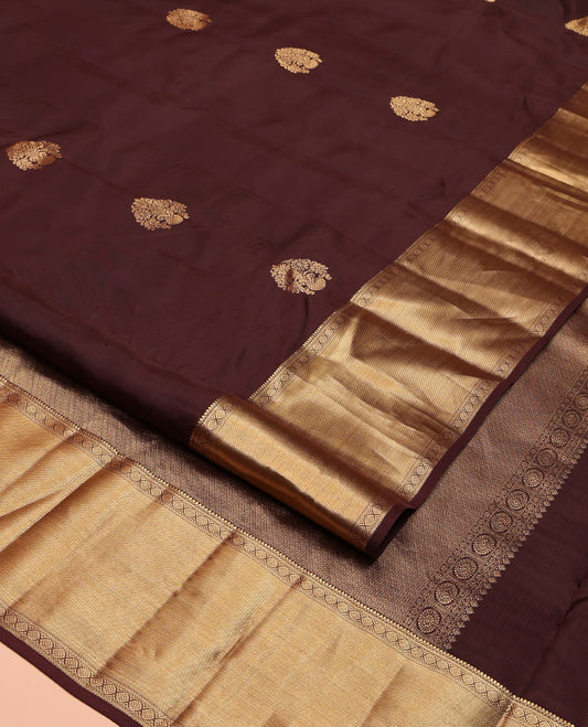 Brown Vasundhara Silk Mix Saree, Decked Up with Zari Buttas All Over Its Body, Highlighted by Zari Border of Thilakam Mokku, Laddu Kamalam, and Zari Designs, Grand Jaal Pallu and Paired with a Matching Blouse