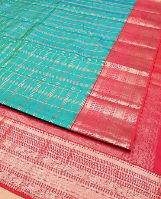 Green Vasundhara Silk Saree, Enriched with Zari Checked Designs All Over Its Body, Complemented by a Contrast Border of Manga, Muthu, Banaras, Rudraksham, and Yaali Designs, Grand Jaal Pallu, and Paired with a Contrast Blouse