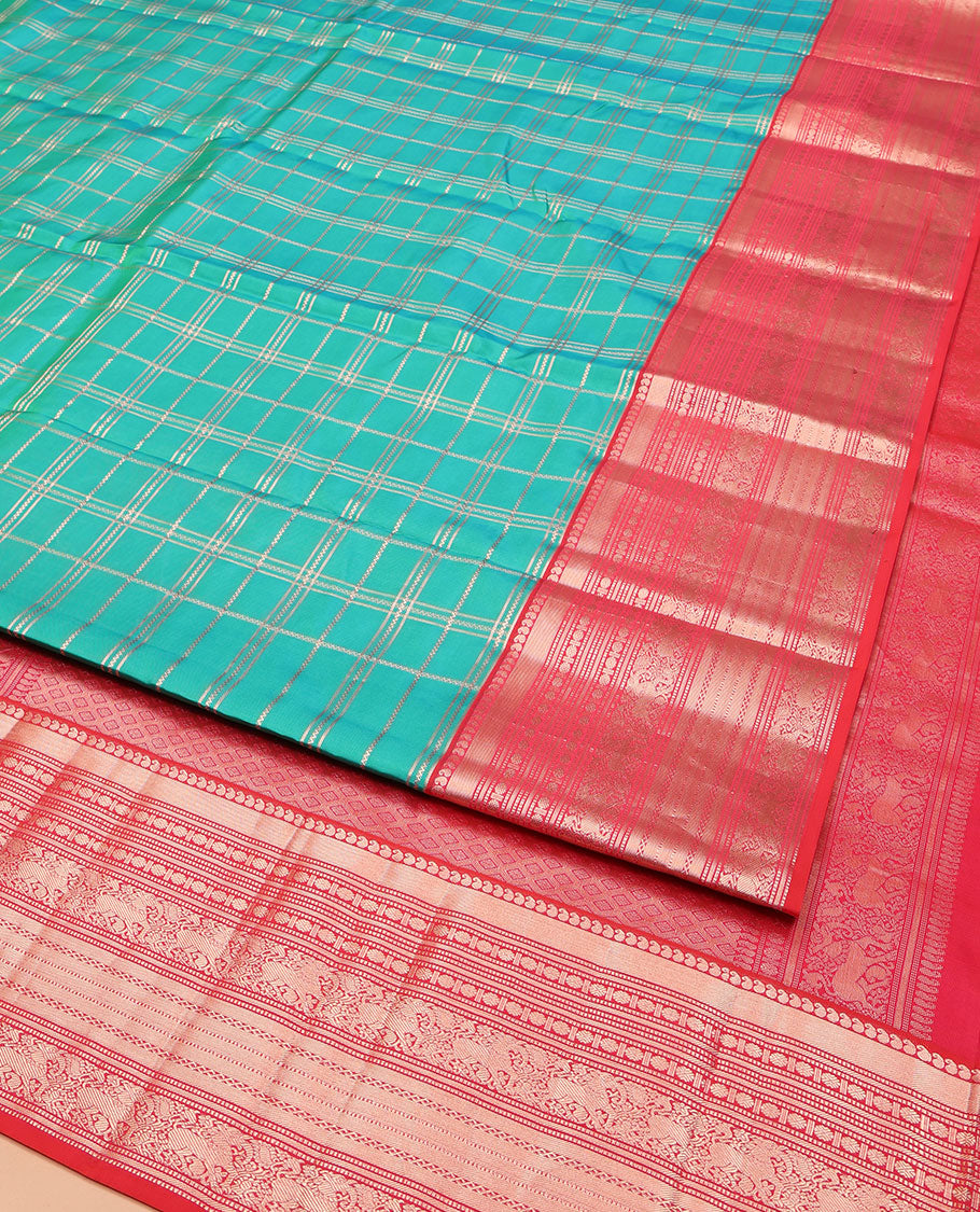 Green Vasundhara Silk Saree, Enriched with Zari Checked Designs All Over Its Body, Complemented by a Contrast Border of Manga, Muthu, Banaras, Rudraksham, and Yaali Designs, Grand Jaal Pallu, and Paired with a Contrast Blouse