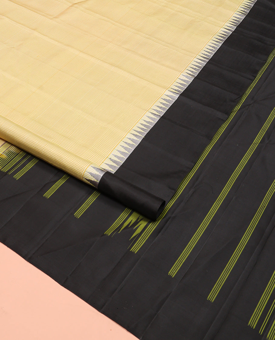 Yellow micro-checked Kanchipuram silk saree, contrast thazampoo rekku border, and striped pallu