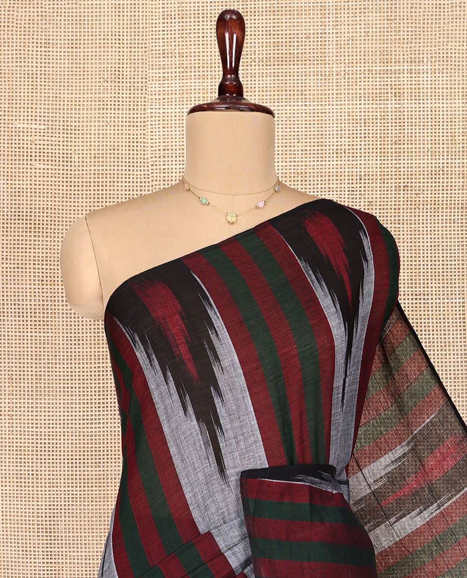 Grey Ikkat Cotton Saree, Adorned with Stripes on Its Body, Complemented by a Contrast Temple Border, Pallu of Ikkat-Style Intricate Designs, and Has No Blouse