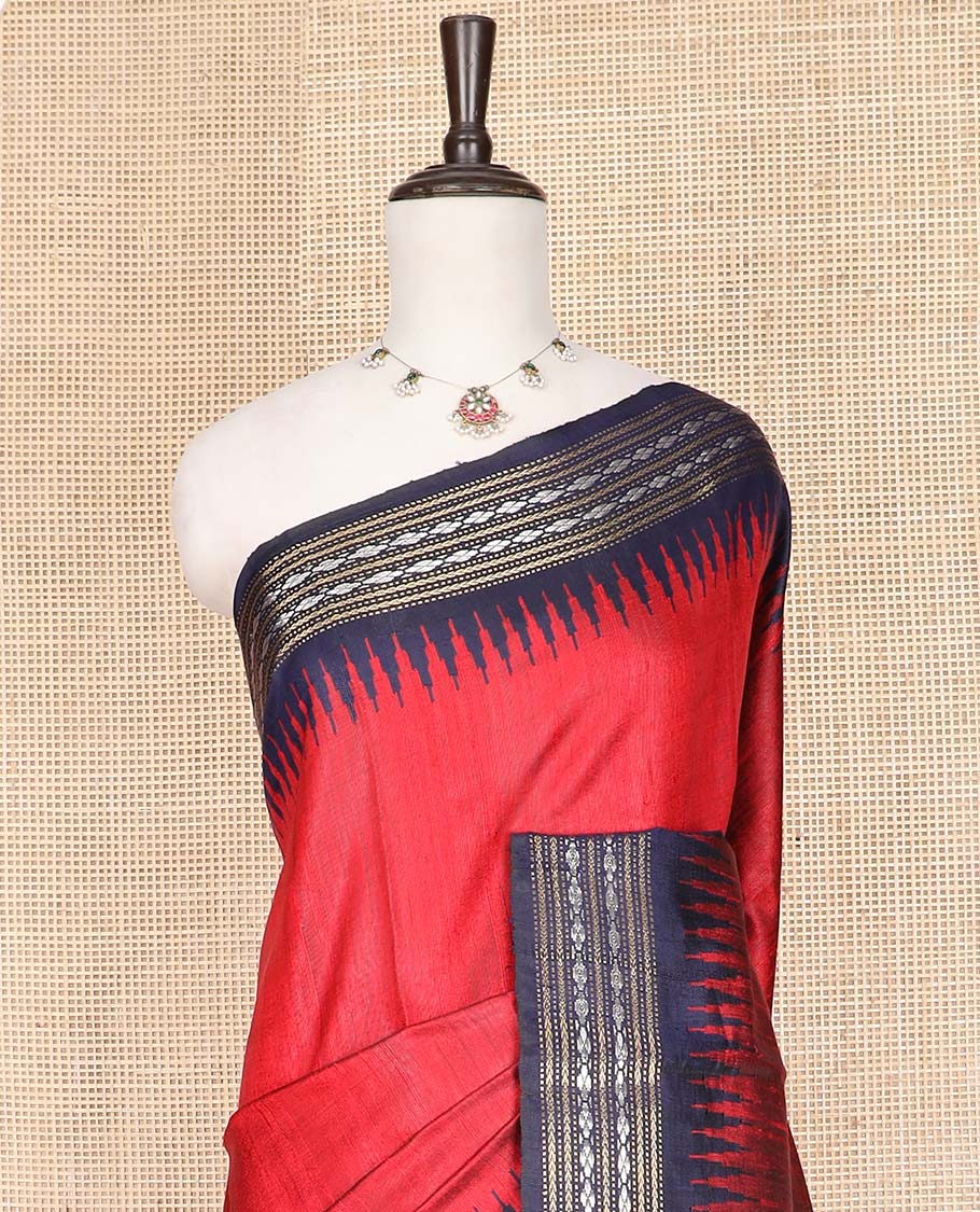 Red Plain Dupion Silk Saree, Complemented by a Contrast Temple Border  of Traditional Motifs in Thread, Pallu of Ikkat Designs, and Paired with a Contrast Blouse