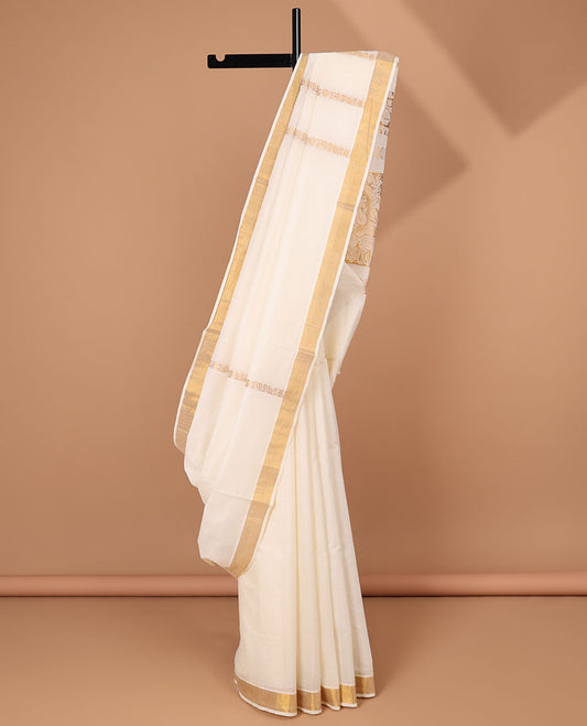 Cream kerala saree with zari designs, zari border & pallu of traditional designs in zari