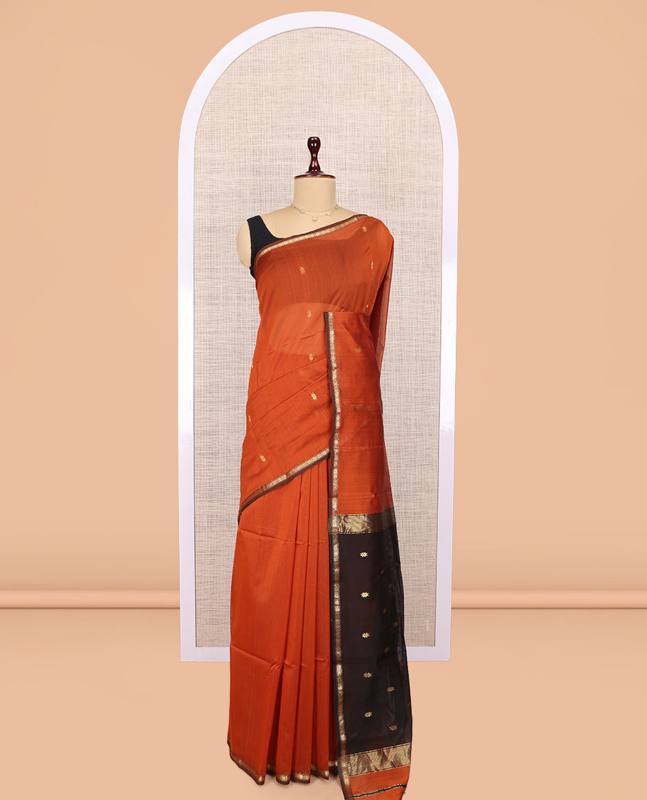 Orange Maheshwari Cotton Saree, Adorned with Buttas, a Subtle Contrast Piping Border, Pallu Gleamed Up with Zari Buttas, and a Contrast Blouse