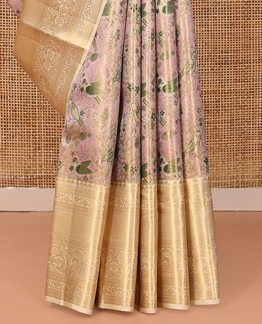 Pale Pink Kanchipuram Tissue Silk Saree, Decked Up with Floral-Bird Jacquard, a Contrast Border of Thilakam Mokku, Kodi Visiry, Mayil, and Mayil Kann, Intricate Pallu, and Contrast Blouse