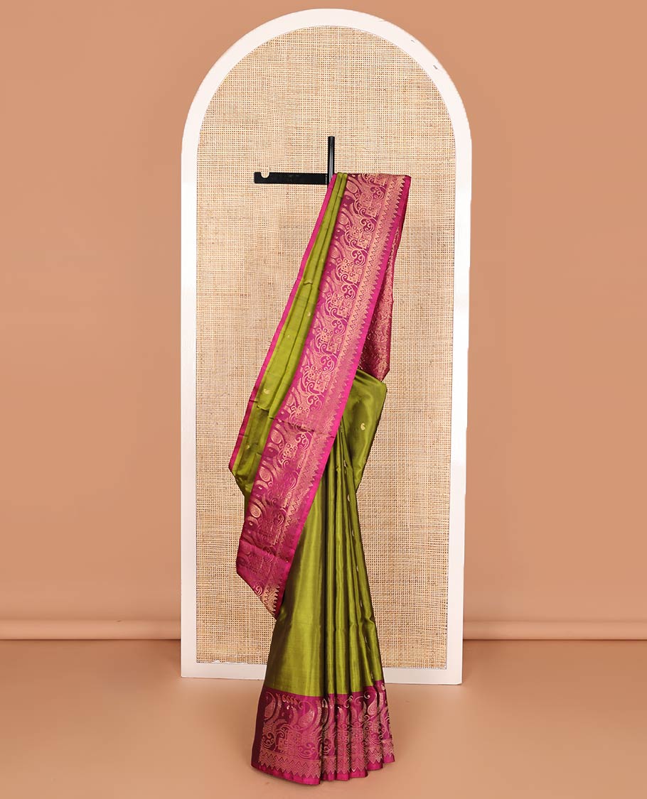 Green manga buttas soft silk saree, contrast border, and pallu of intricate zari designs