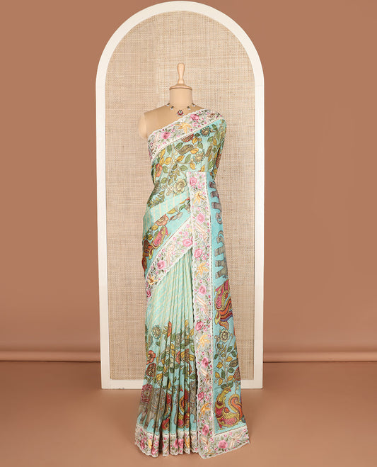 Blue buttas with bandhani and kalamkari floral-fauna printed dola silk saree, contrast floral embroidered scallop border