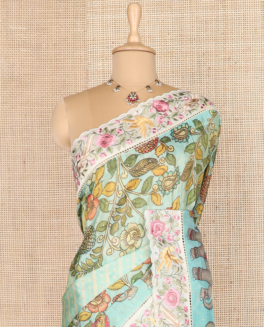 Blue buttas with bandhani and kalamkari floral-fauna printed dola silk saree, contrast floral embroidered scallop border