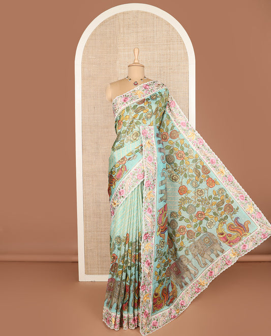 Blue buttas with bandhani and kalamkari floral-fauna printed dola silk saree, contrast floral embroidered scallop border