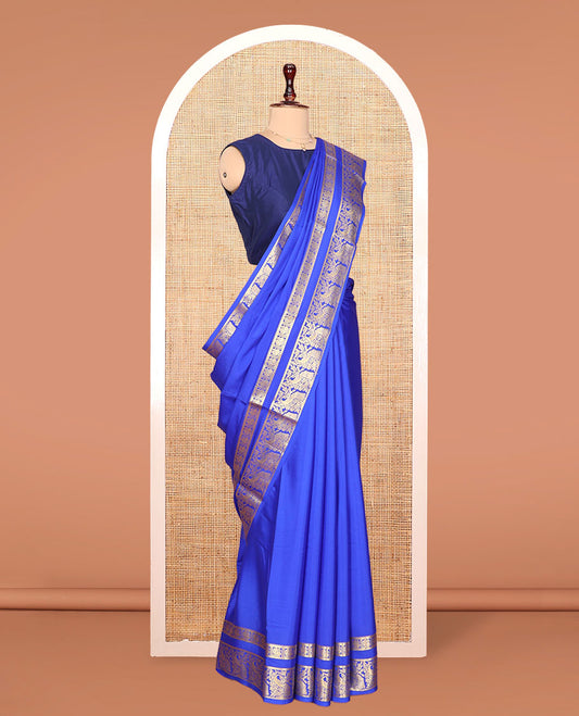Blue Plain Mysore Silk Saree, Richly Detailed with Zari Border of Peacock Designs, Sparsely Woven Pallu of Stripes, and Paired with a Matching Blouse