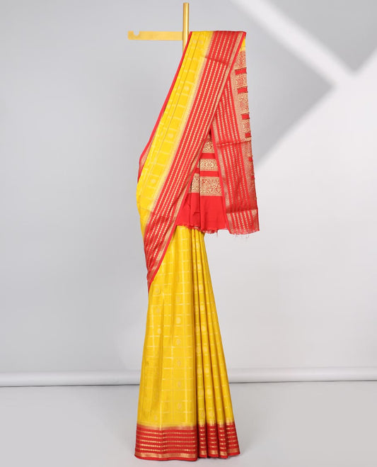 Yellow floral motifs enclosed with checked mysore silk saree with contrast striped zari border & pallu of intricate design