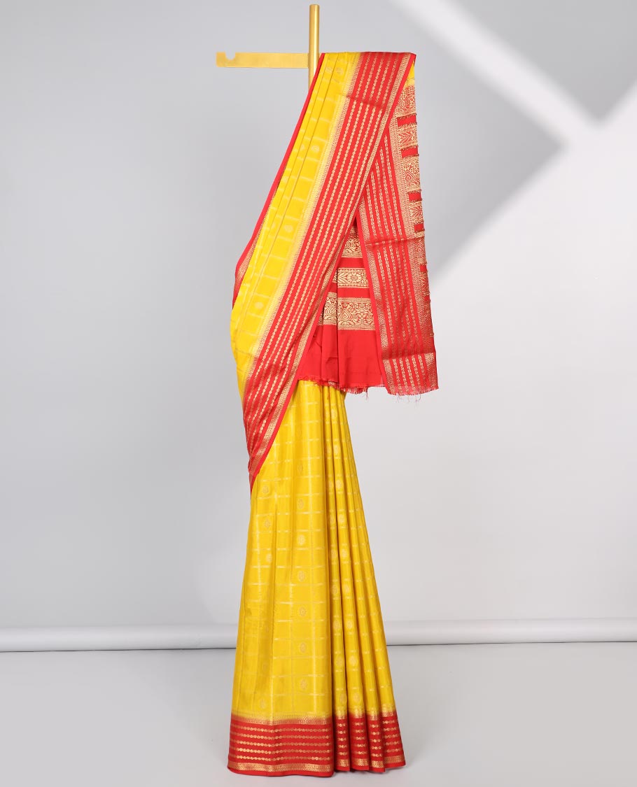Yellow floral motifs enclosed with checked mysore silk saree with contrast striped zari border & pallu of intricate design