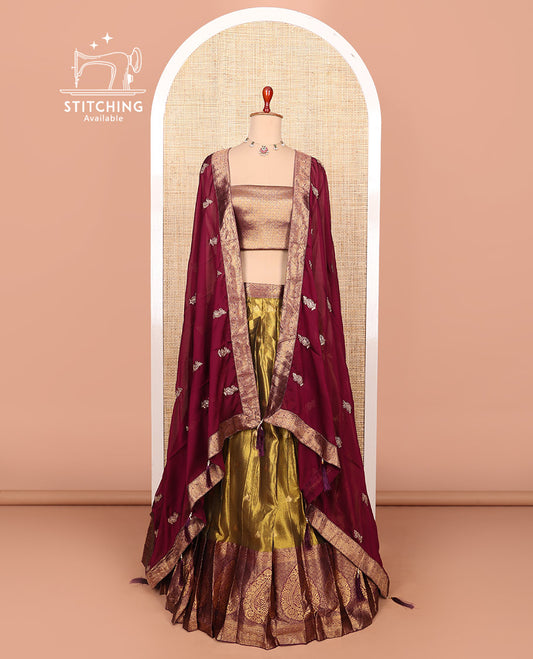 Gold-maroon zari buttas half-saree with contrast Mughal-style thilak motifs woven bordered skirt, brocade blouse, and a zari design dhavani