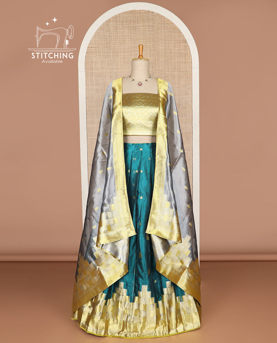 Blue geometric design tissue half saree with contrast temple border, zari design blouse & floral design dhavani
