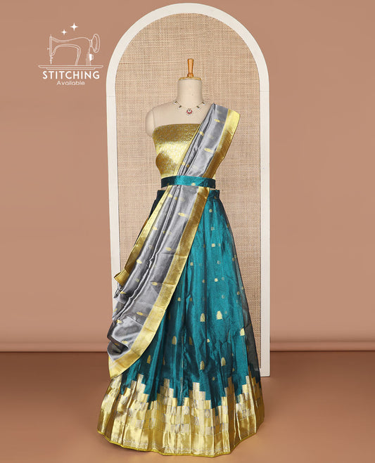 Blue geometric design tissue half saree with contrast temple border, zari design blouse & floral design dhavani