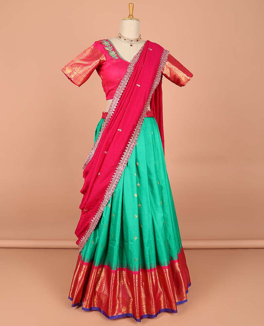 Green buttas semi-stitched half saree with contrast zari border,  embroidered blouse & scallop border dhavani