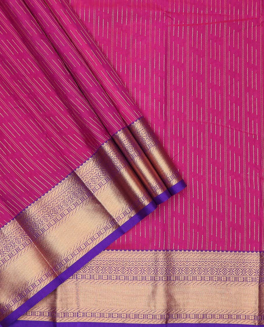 Magenta art silk pavadai material, zari buttas with contrast traditional zari bordered skirt, and a contrast bordered blouse