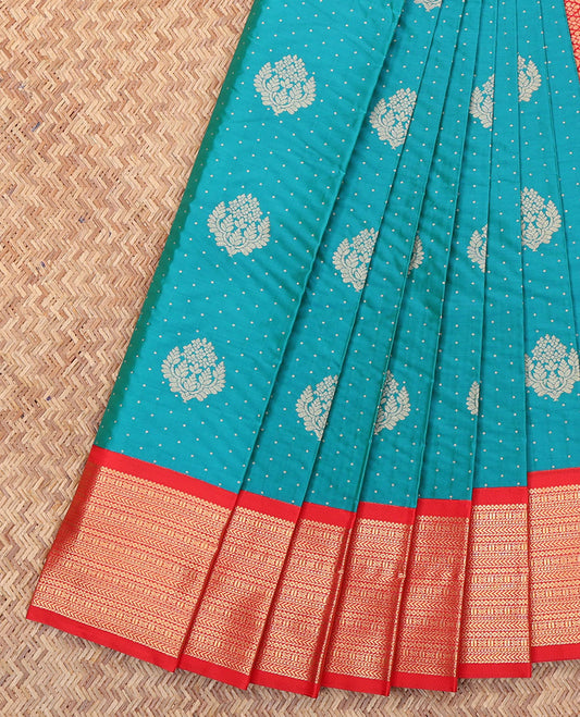 Peacock Blue Budget Silk Saree, Decorated with Zari Buttas All Over Its Body, Complemented by a Contrast Traditional Zari Design Border, Intricately Designed Pallu, and Paired with a Contrast Blouse