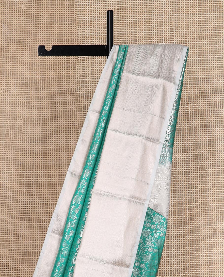 Turquoise Blue floral jaal jacquard budget silk saree, contrast traditional zari border, and intricate pallu