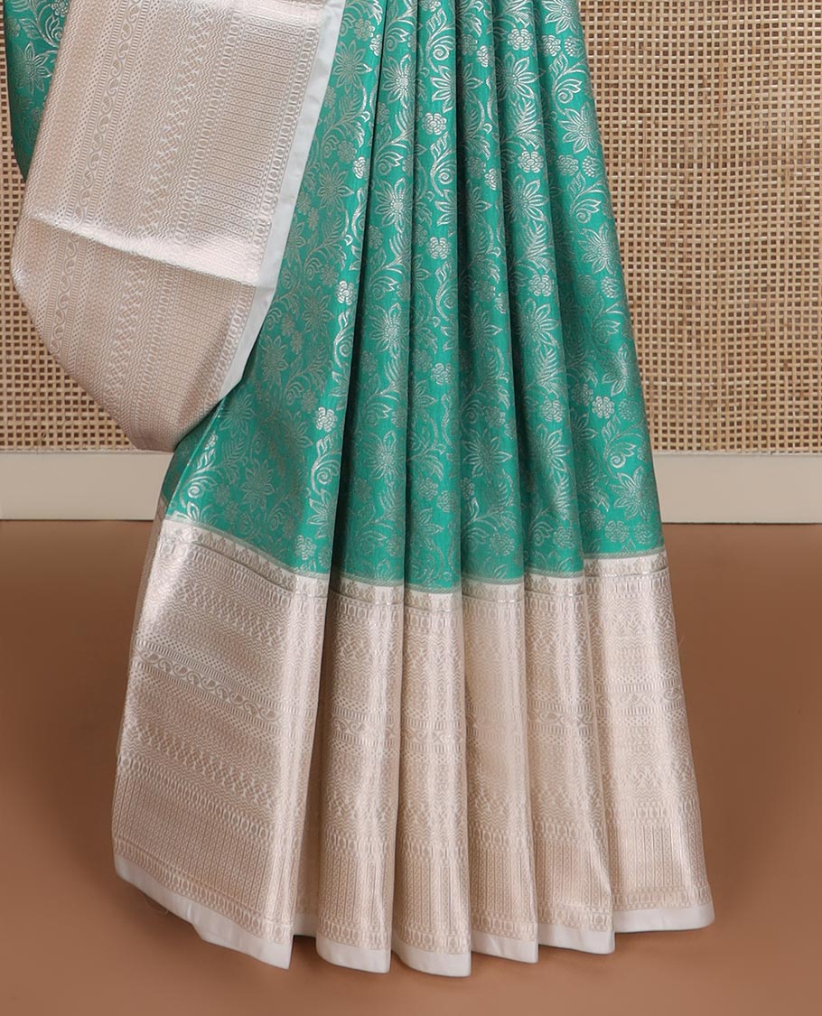 Turquoise Blue floral jaal jacquard budget silk saree, contrast traditional zari border, and intricate pallu