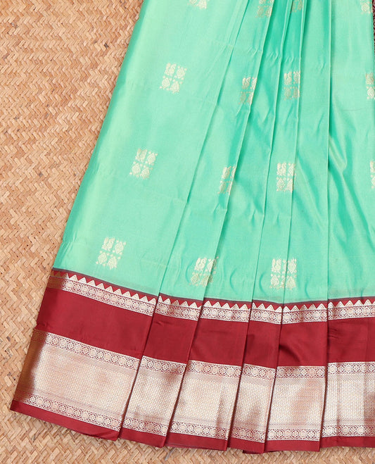 Turquoise Budget Silk Saree, Meticulously Woven with Zari Buttas All Over Its Body, Complemented by a Contrast Traditional Zari Design Woven Rettai Pettu Border, Gleaming Jaal Pallu, and Paired with a Contrast Blouse