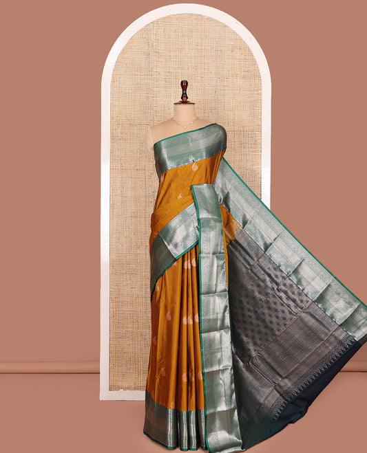 Mustard Budget Silk Saree, Enriched with Paisley Zari Buttas All Over Its Body, Complemented by a Contrast Traditional Zari Designs Woven Border, Majestically Detailed Pallu, and Paired with a Contrast Blouse