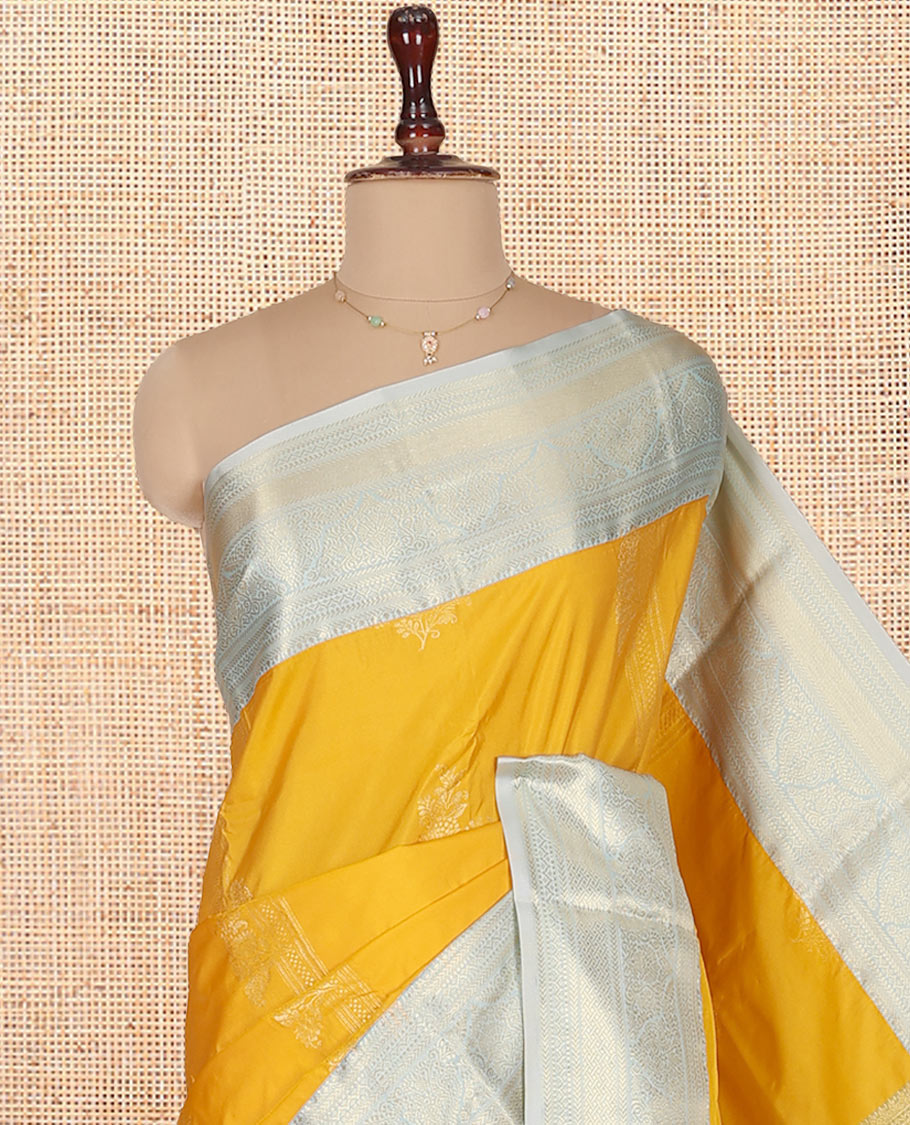 Yellow Budget Silk Saree, Sparsely Threaded with Zari Buttas on Its Body, Complemented by a Contrast Traditional Zari Design Border, Grand Zari Woven Pallu, and Paired with a Contrast Blouse