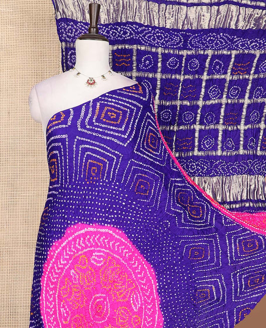 Ink blue geometric themed bandhani dotted bandhani silk saree, butta enclosed thick zari checked gharchola pallu