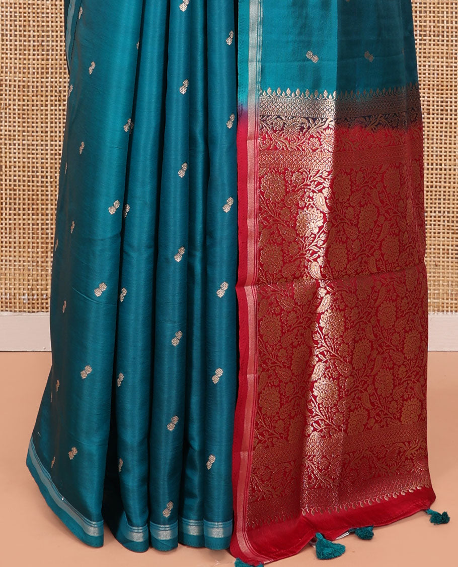Peacock Blue Satin Silk Saree, Enthralled with Buttas All Over Its Body, a Subtle Piping Border, Complemented by a Contrast Pallu of Floral-Paisley Designs in Zari, and Paired with a Contrast Blouse