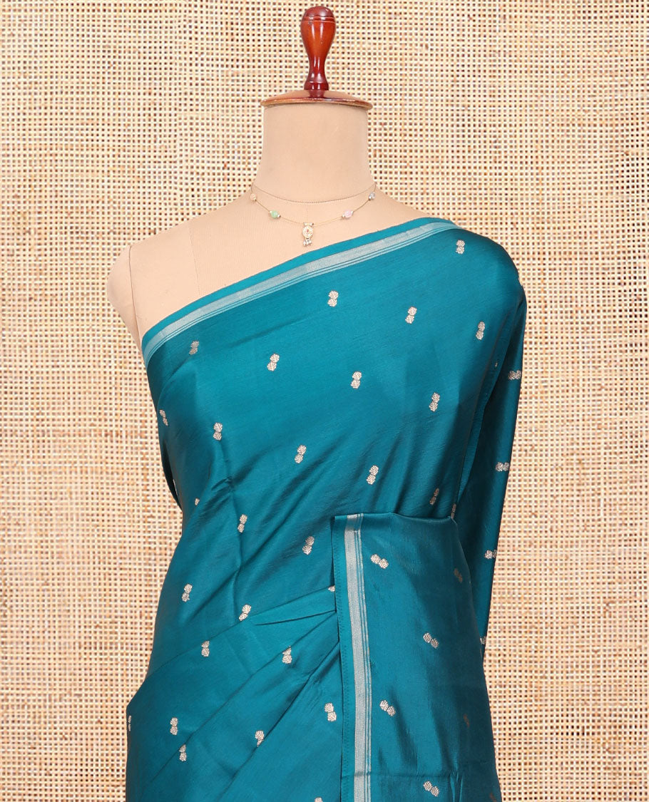 Peacock Blue Satin Silk Saree, Enthralled with Buttas All Over Its Body, a Subtle Piping Border, Complemented by a Contrast Pallu of Floral-Paisley Designs in Zari, and Paired with a Contrast Blouse