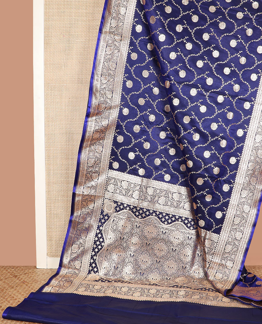 Navy blue floral jaal jacquard banarasi silk saree, contrast floral creeper design border, and intricate ogee patterned pallu