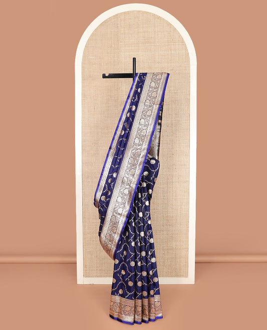 Navy blue floral jaal jacquard banarasi silk saree, contrast floral creeper design border, and intricate ogee patterned pallu