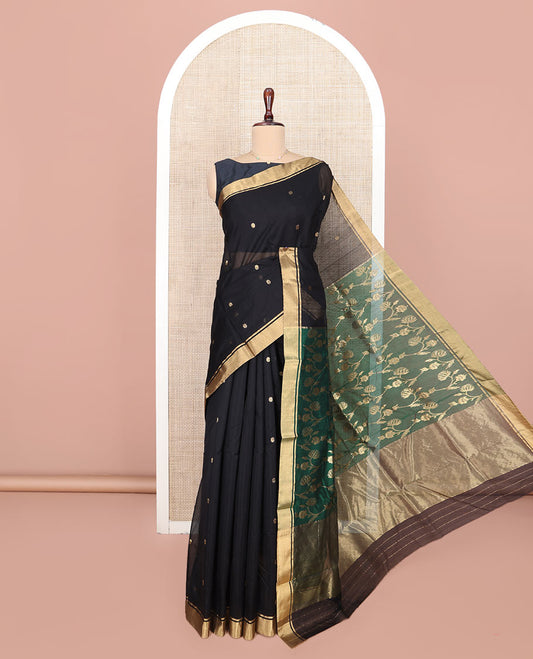 Black Chanderi Cotton Saree, Ornamented with Floral Buttas All Over Its Body, Highlighted by Zari Border, Complemented by Contrast Pallu of Floral Jaal Designs, and Paired with a Contrast Blouse