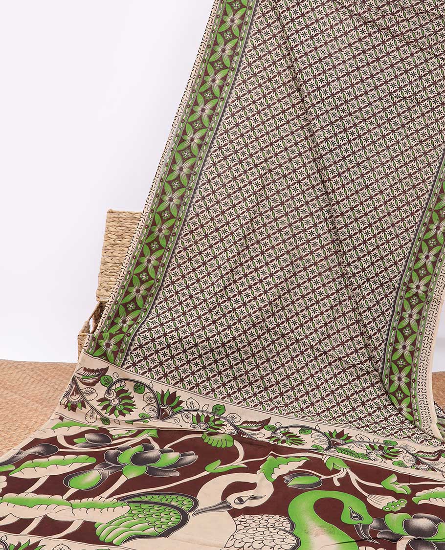 Cream floral enclosed checked design machine-printed kalamkari cotton saree , contrast floral border & peacock design pallu
