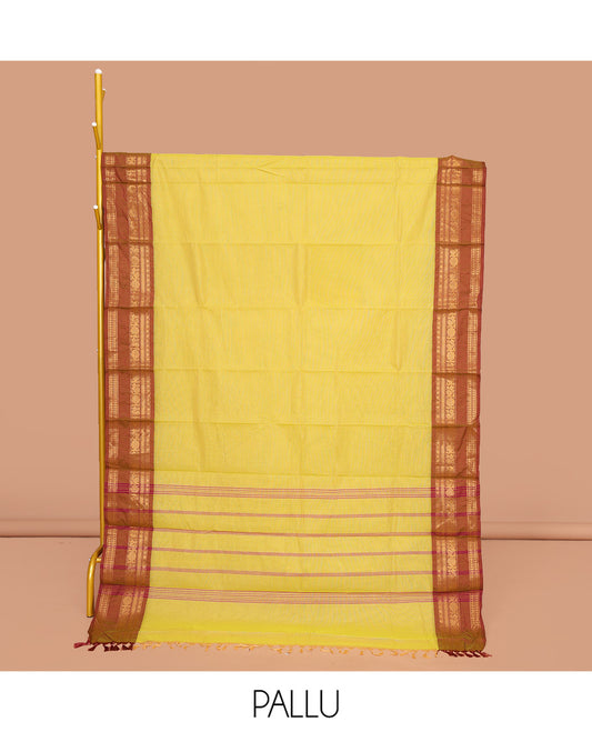 Yellow Plain Chettinad Cotton Saree, Complemented by a Contrast Traditional Zari Design Rettai Pettu Border, Pallu of Stripes, and Paired with a Matching Blouse