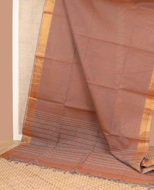 Brown sparesly striped jute cotton saree, bavanji zari border, and striped pallu