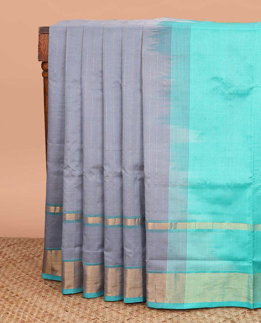 Grey striped poly cotton saree, contrast bavanji zari border, and striped blue pallu
