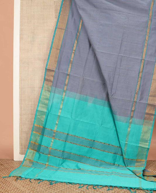Grey striped poly cotton saree, contrast bavanji zari border, and striped blue pallu