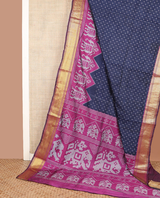 Navy blue buttas semi-banaras patola silk saree, contrast elephant motifs border of traditional zari designs, and pallu of elephant motifs