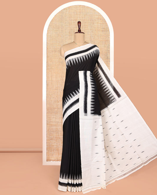 Black Plain Ikkat Cotton Saree, Complemented by a Contrast Ikkat Temple Border, Pallu Steeped with Buttas, and Paired with a Contrast Blouse