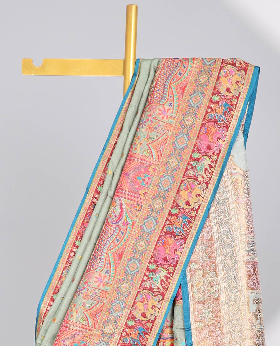 Green motifs  semi-banaras dola silk saree with contrast embroidered border & wedding theme design pallu