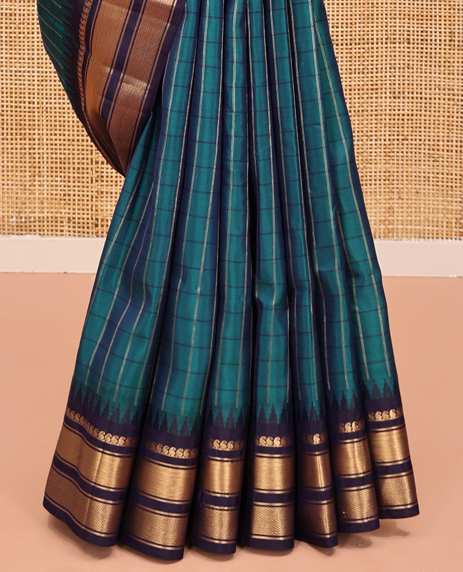 Mayil Color and Navy Blue Vasundhara Lite Silk Mix Saree, Graced with Checked Design All Over Its Body, Complemented by a Contrast Thazampoo Rekku Border of Manga Mokku, Muthu, and Mayil Kann Designs, Grand Pallu, and Paired with a Contrast Blouse
