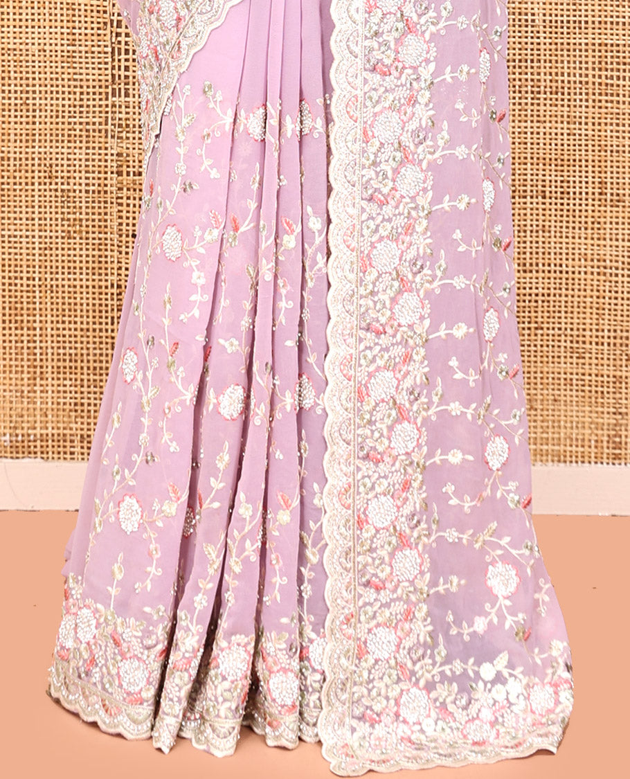 Pale Pink Designer Saree, Beautifully Bedecked with Floral Vine Embroidery, a Scallop Embroidered Border, and a Matching Blouse