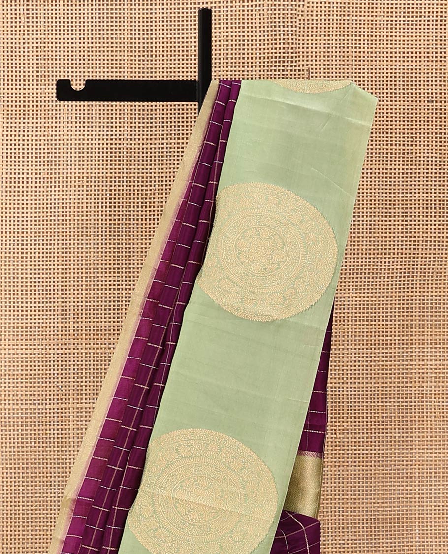 Purple Raw Mango Silk Saree Enthralled with Checks, Features a Contrast Chakram Motifs Border, a Zari-Elevated Pallu, and Paired with a Contrast Blouse