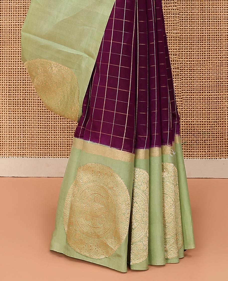 Purple Raw Mango Silk Saree Enthralled with Checks, Features a Contrast Chakram Motifs Border, a Zari-Elevated Pallu, and Paired with a Contrast Blouse