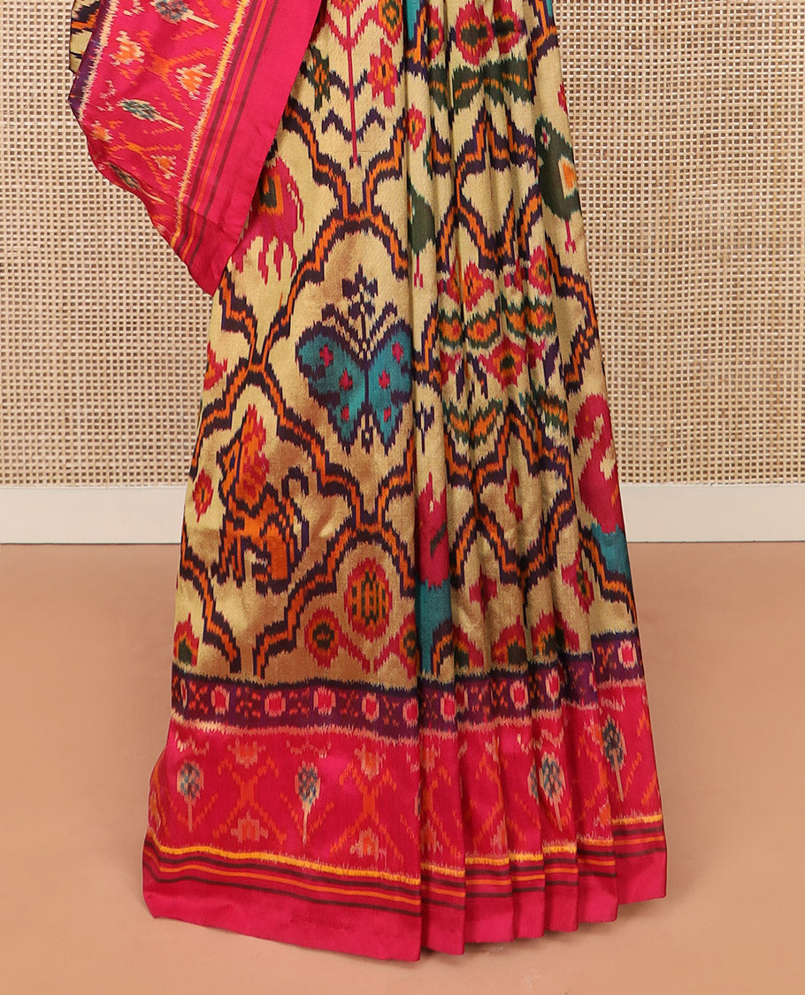 Sandal Ikkat Silk Saree Featuring Kaleidoscopic-Coloured Flora or Fauna Motifs Enclosed in Mughal Jaal, Complemented by a Contrast Ikkat Border, Adorned with a Pallu of Patola Fauna Motifs, and a Plain Contrast Blouse