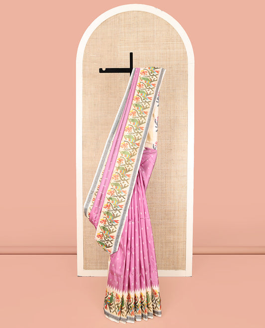 Pink Ikkat Silk Saree, Enthralled with Buttas All Over Its Body, Complemented by a Contrast Temple Border of Floral-Parrot Designs, Pallu of Floral-Parrot Designs, and Paired with a Contrast Blouse